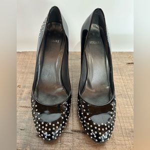 Stuart Weitzman black patent leather pumps with silver stud details - size 8.